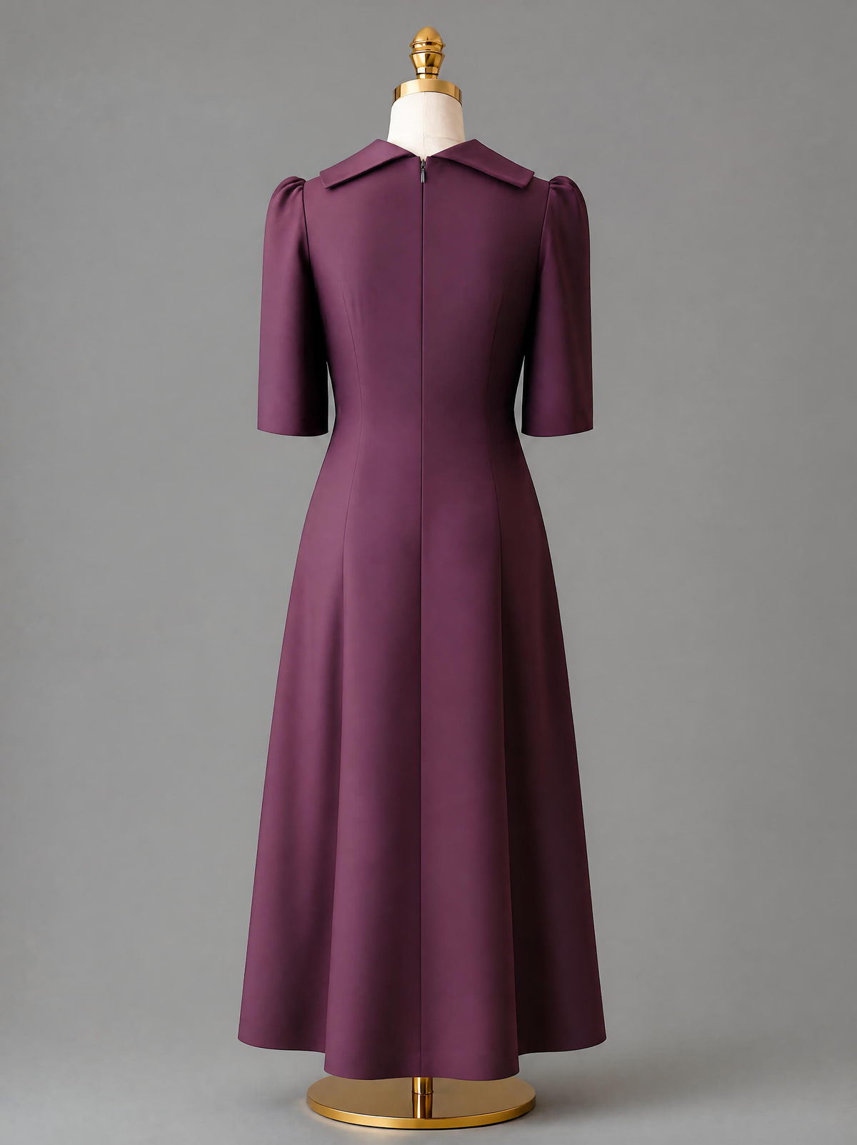  Back view of the Amethyst purple dress displaying the structured silhouette of the A-line dress with pleats and a laced-up corset.