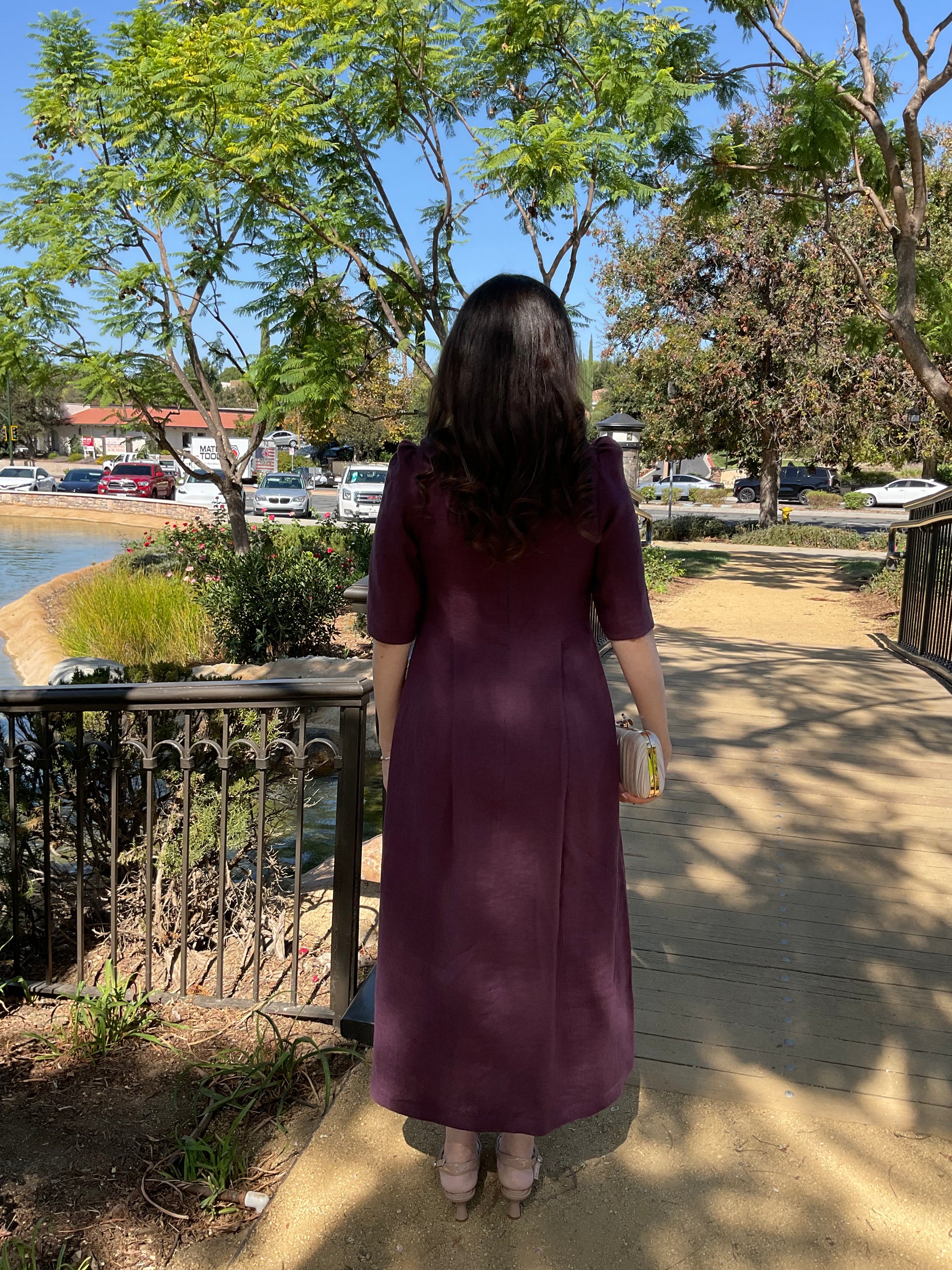 Back view of the royal purple linen Amethyst Maxi Dress showing the fluid drape and clean finish.
