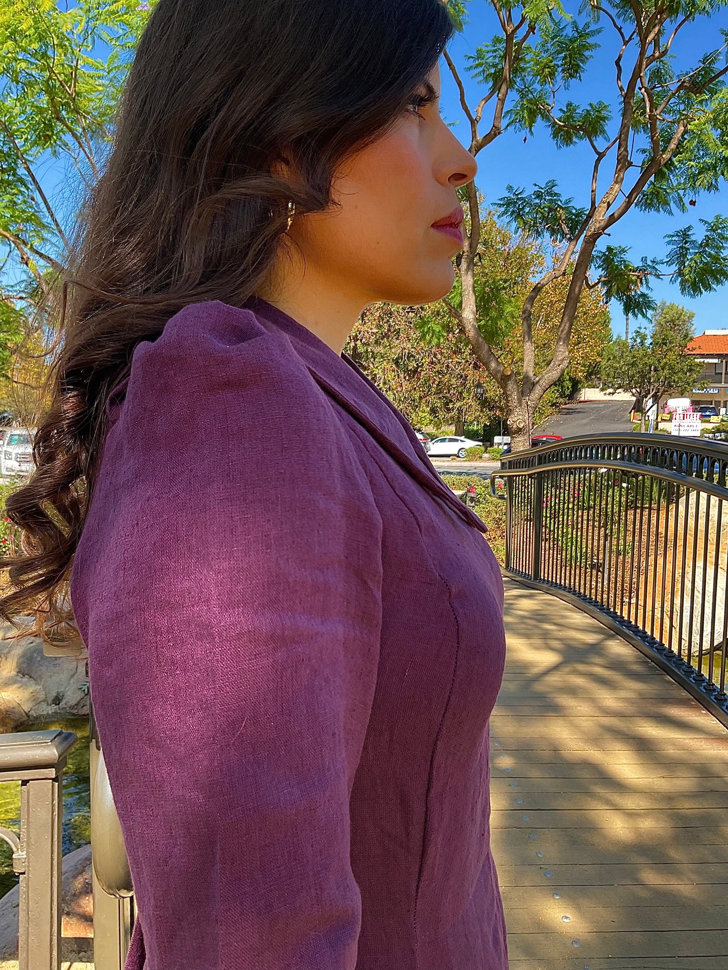 Side profile view of the royal purple linen Amethyst Maxi Dress showing its elegant, tailored silhouette.