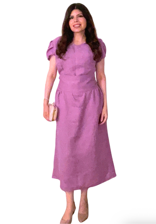Woman wearing a purple dress on a white background