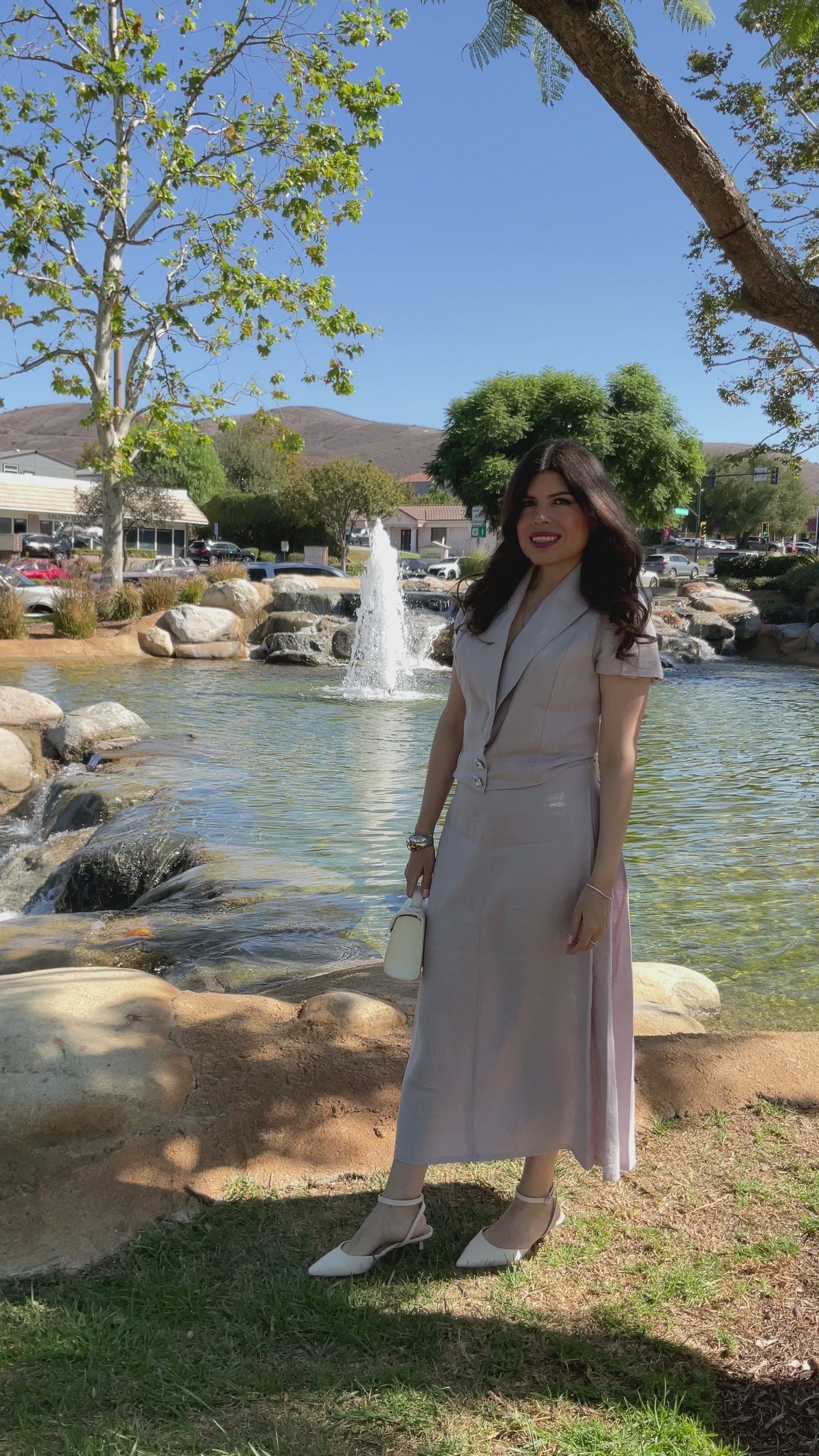 • Video showing the front view, beautiful drape, and premium rhinestone buttons of The Silent Dove 2-piece gray linen suit.
